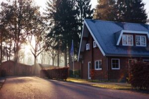 Should I pay off mortgage or invest? An old cottage house at dawn