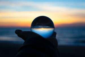 company owner looking at a glass ball to predict it's valuation