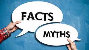 two thought bubbles being held up by hands reading "facts" and "myths"