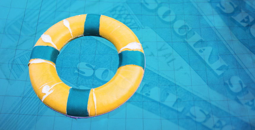 Life preserver floating in pool of social security cards